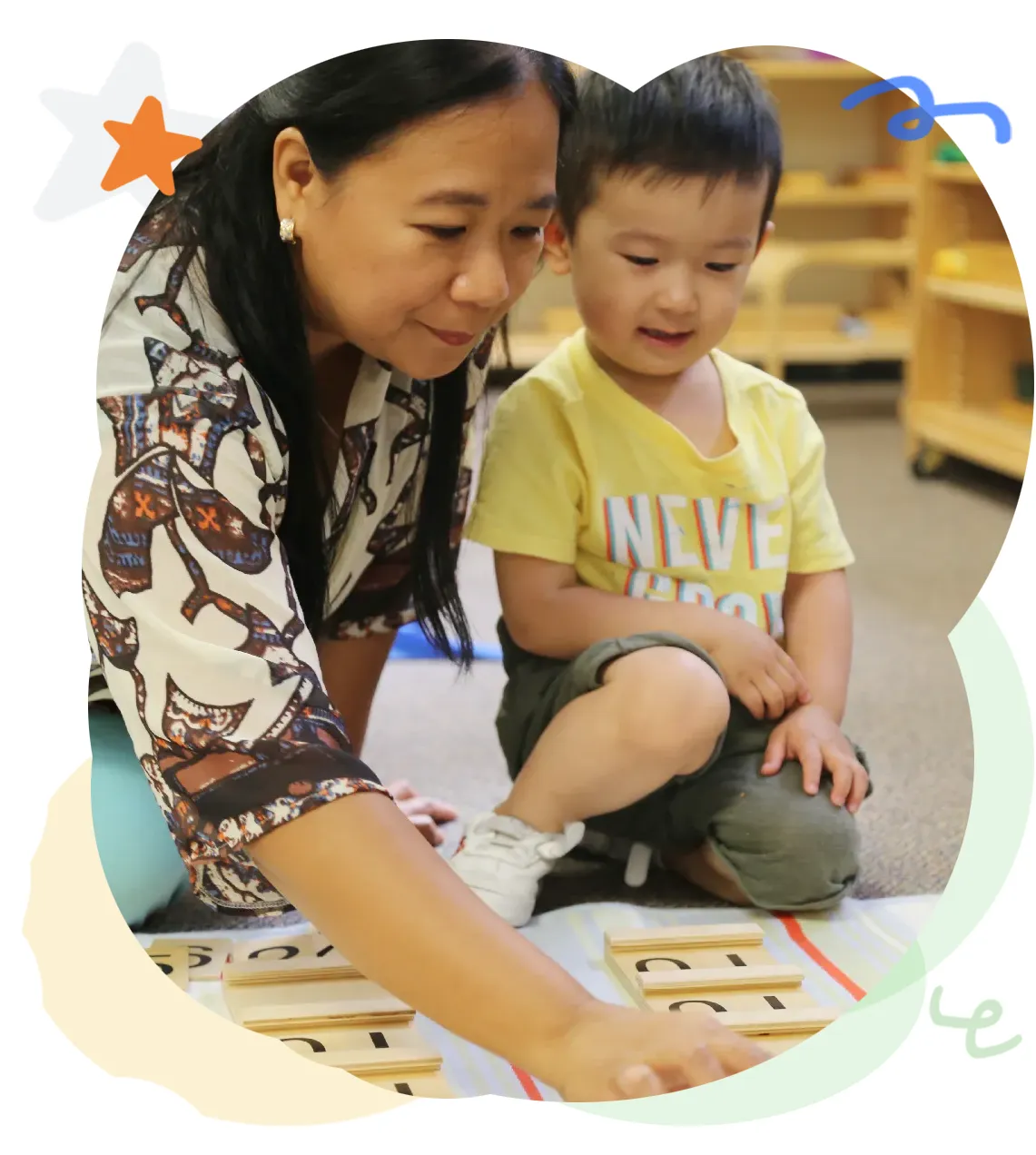 Teacher guiding a child during a Montessori classroom activity