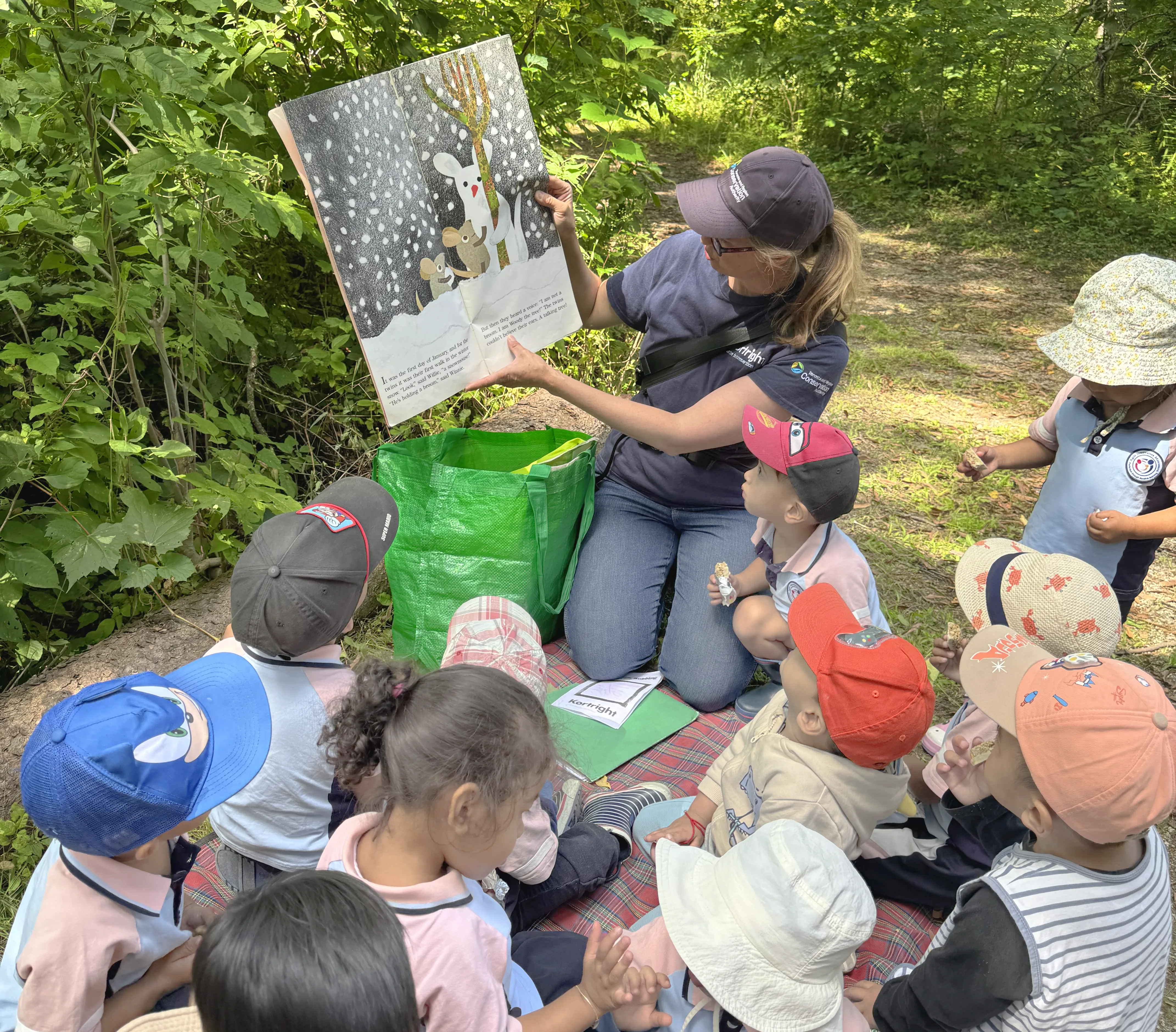 Children learning together outdoors during the summer